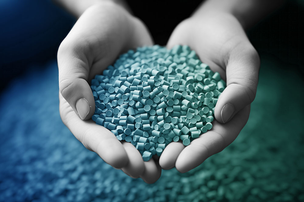 person holding plastic pellets